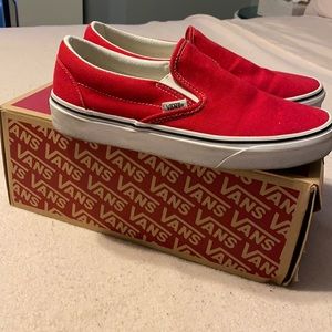Red slip on vans.